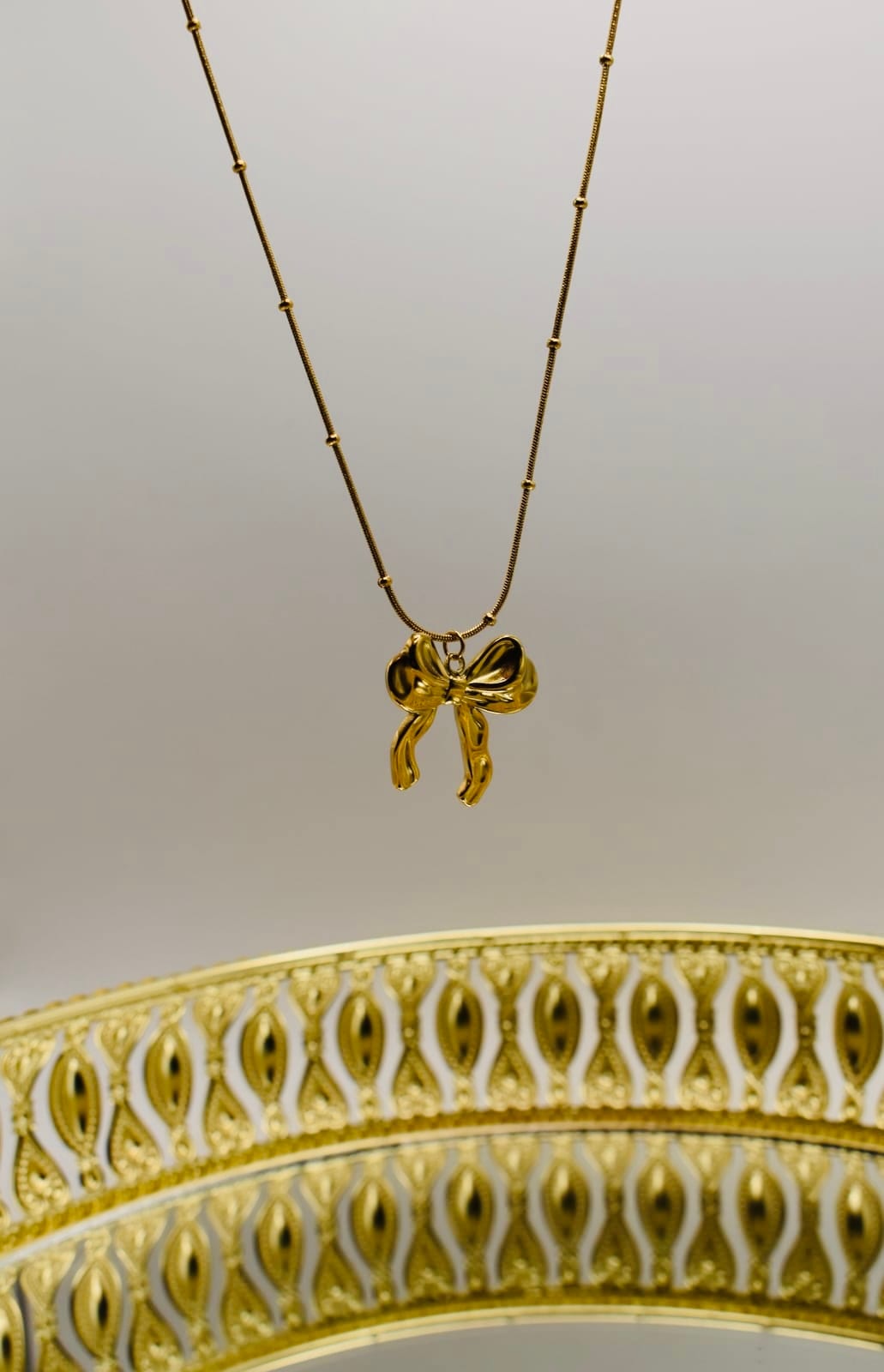 Gold Bow Charm Necklace